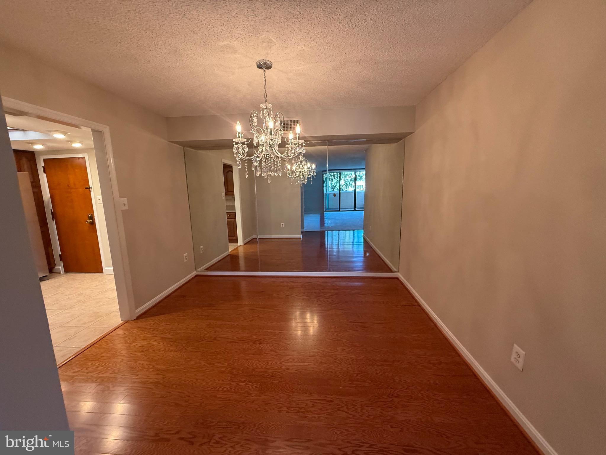 1101 South Arlington Ridge Road, Unit 214 Arlington, VA 22202 - Photo 8 of 41 a view of a livingroom with a chandelier