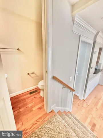 a spacious bathroom with a granite countertop sink a mirror and a shower