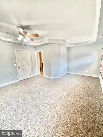 a bathroom with a granite countertop toilet a sink and bathtub