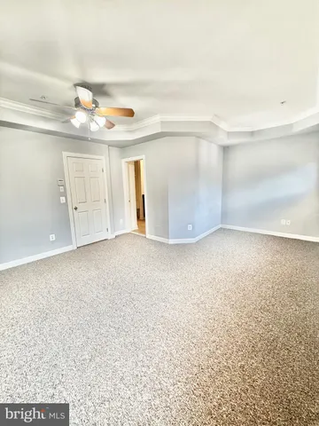 a bathroom with a granite countertop sink toilet mirror and bathtub