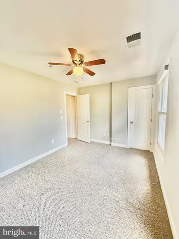 a bathroom with a toilet and a bathtub