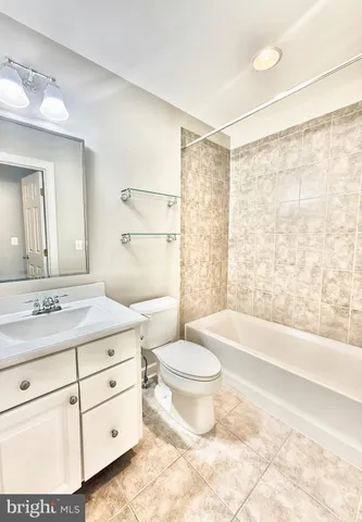 front view of a brick house with a yard