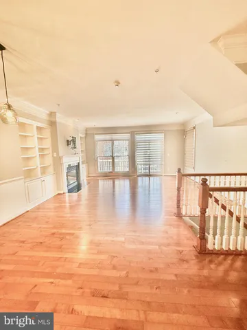 a large kitchen with stainless steel appliances granite countertop a stove a sink and a refrigerator