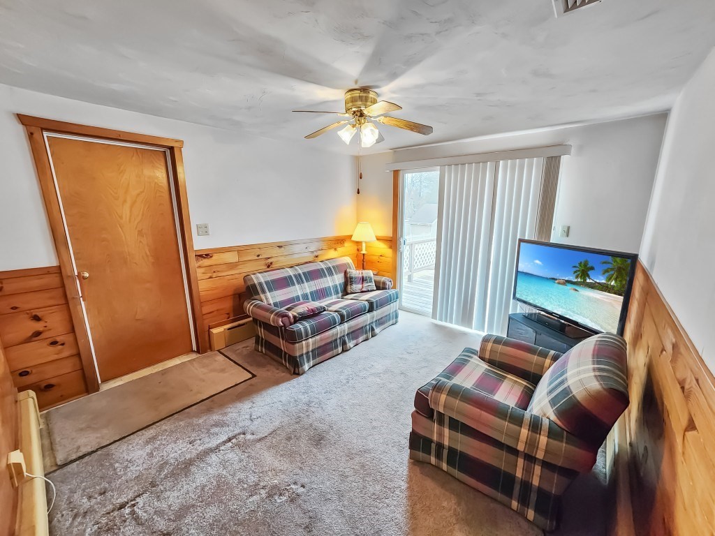 415 Chase Road Dartmouth, MA 02747 - Photo 11 of 34 a living room with furniture a ceiling fan and a window
