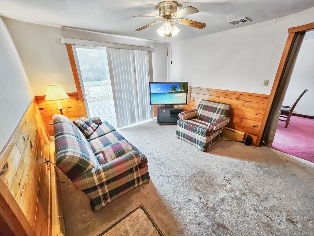 415 Chase Road Dartmouth, MA 02747 - Photo 12 of 34 a bedroom with furniture and a flat screen tv