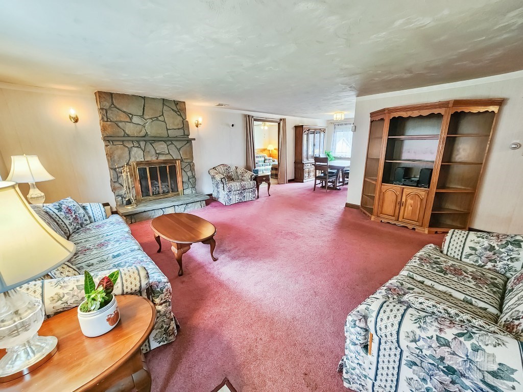 415 Chase Road Dartmouth, MA 02747 - Photo 2 of 34 a living room with furniture and a table