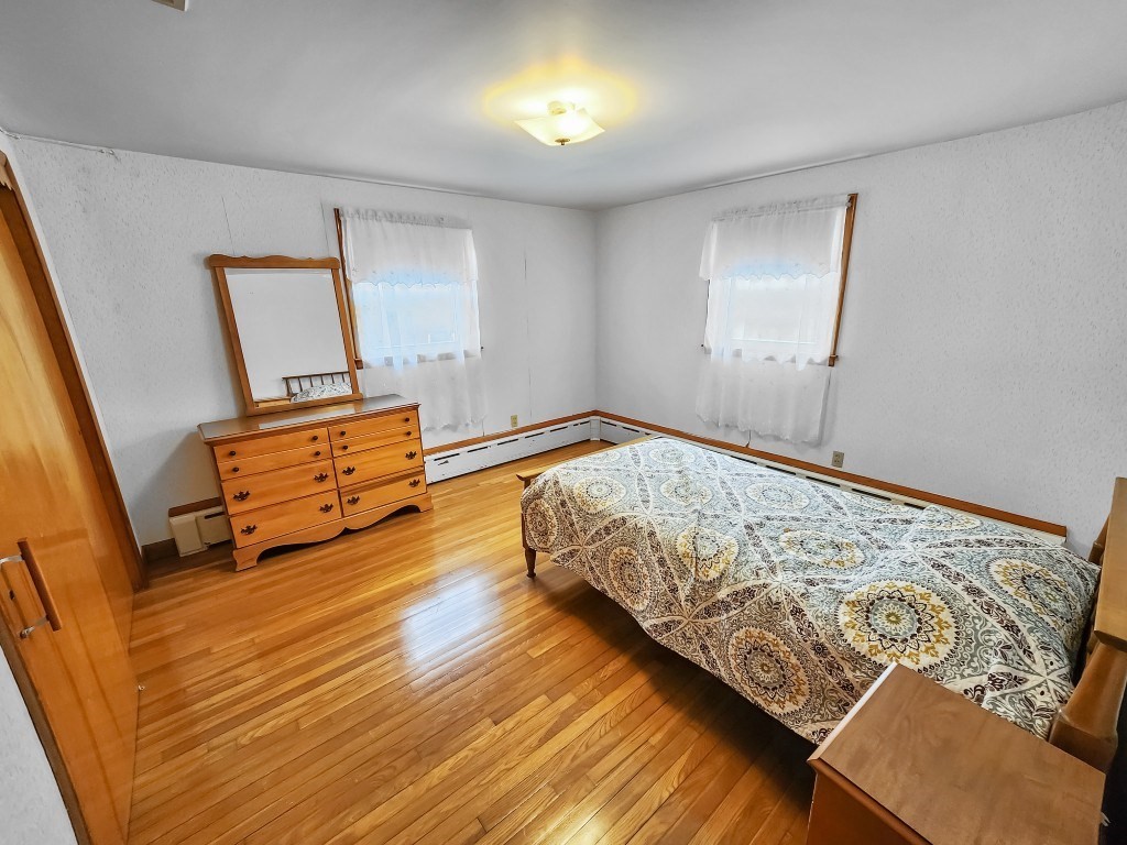 415 Chase Road Dartmouth, MA 02747 - Photo 22 of 34 a bedroom with bed and window