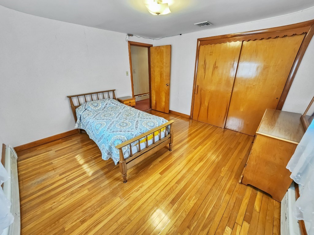 415 Chase Road Dartmouth, MA 02747 - Photo 23 of 34 a bed sitting in a bedroom next to a window