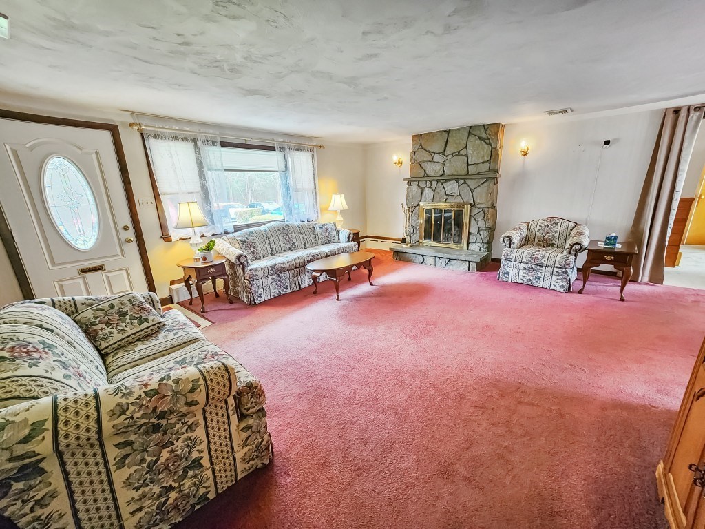 415 Chase Road Dartmouth, MA 02747 - Photo 3 of 34 a living room with furniture and a large window