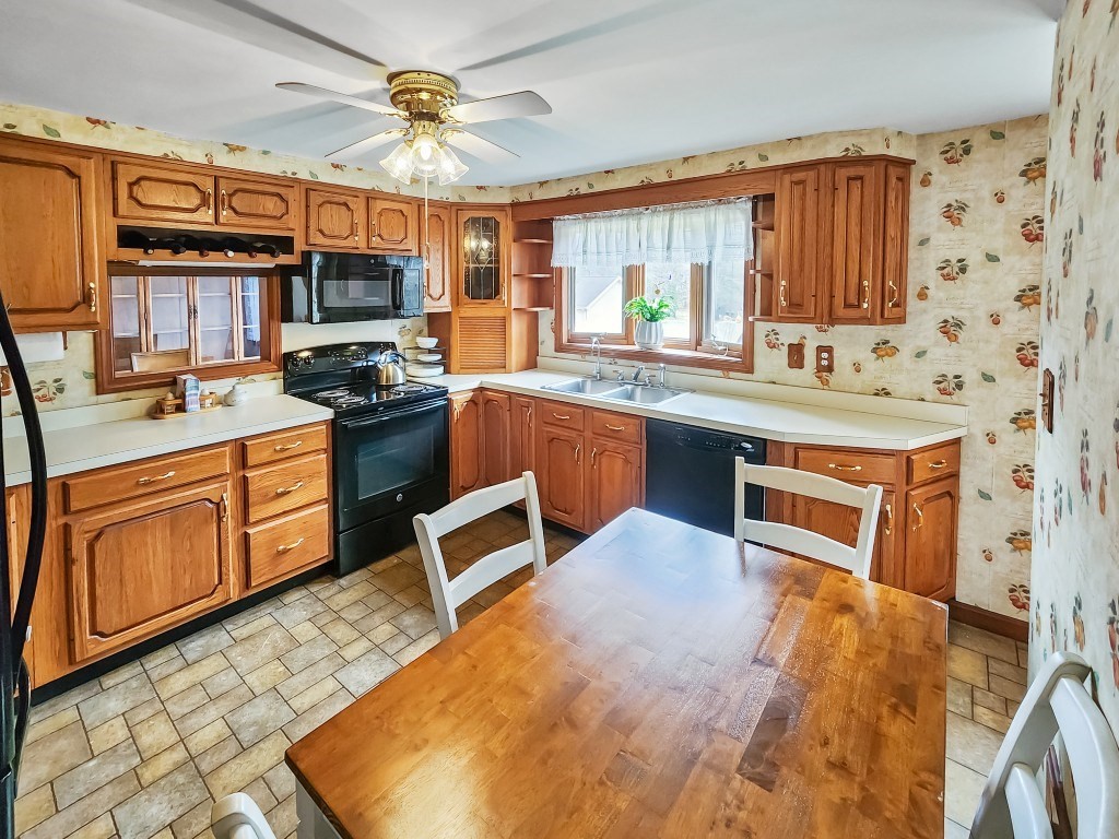 415 Chase Road Dartmouth, MA 02747 - Photo 5 of 34 a kitchen with stainless steel appliances granite countertop a stove sink and cabinets