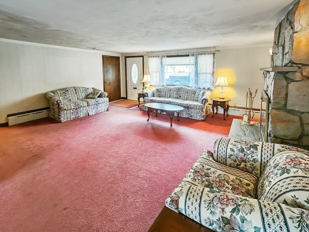 415 Chase Road Dartmouth, MA 02747 - Photo 8 of 34 a living room with furniture and a large window