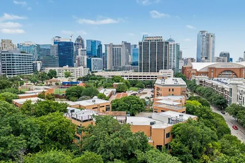 a view of a city with tall buildings