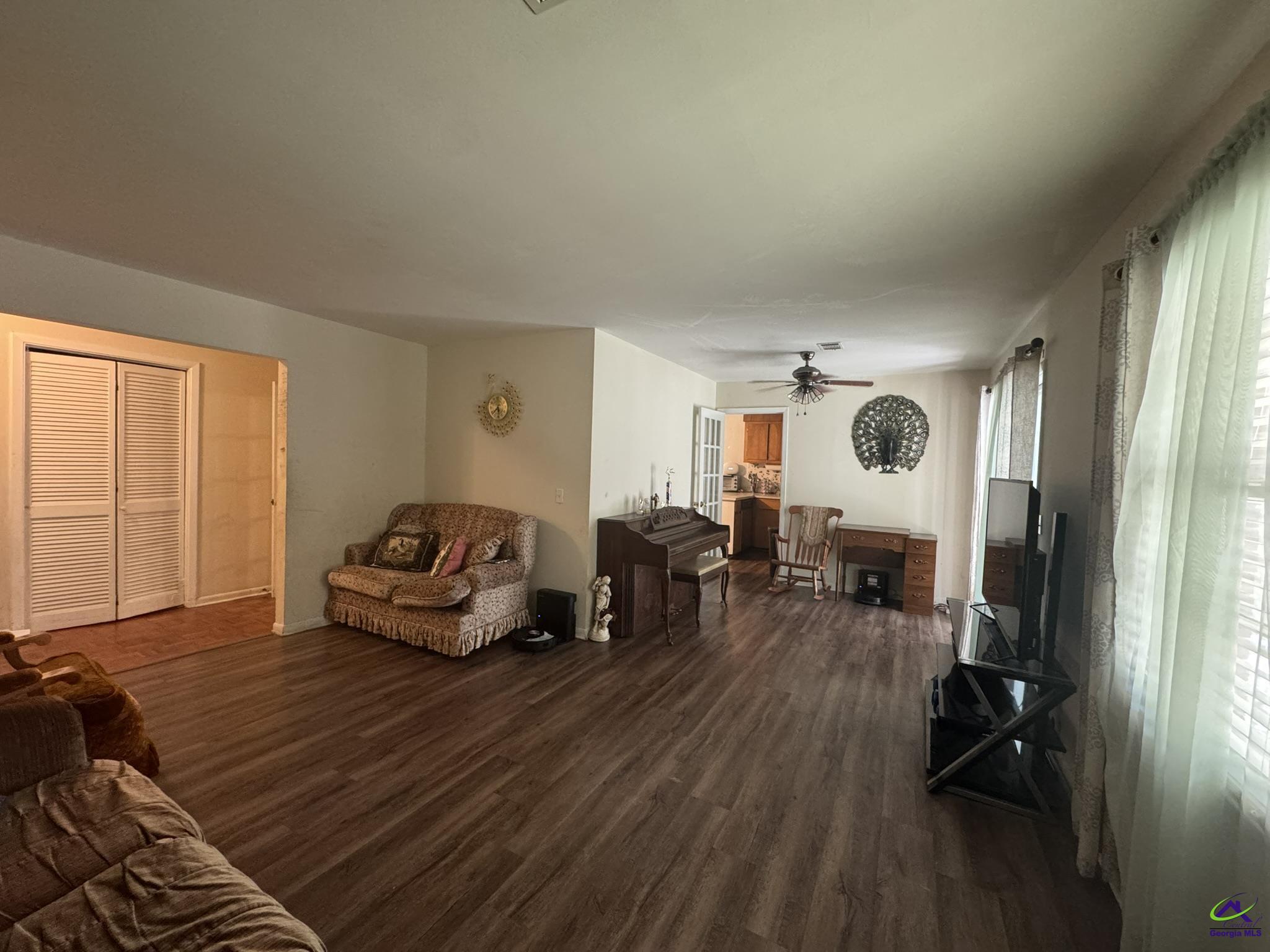 1032 Elberta Road Warner Robins, GA 31093 - Photo 24 of 26 a living room with furniture and a window
