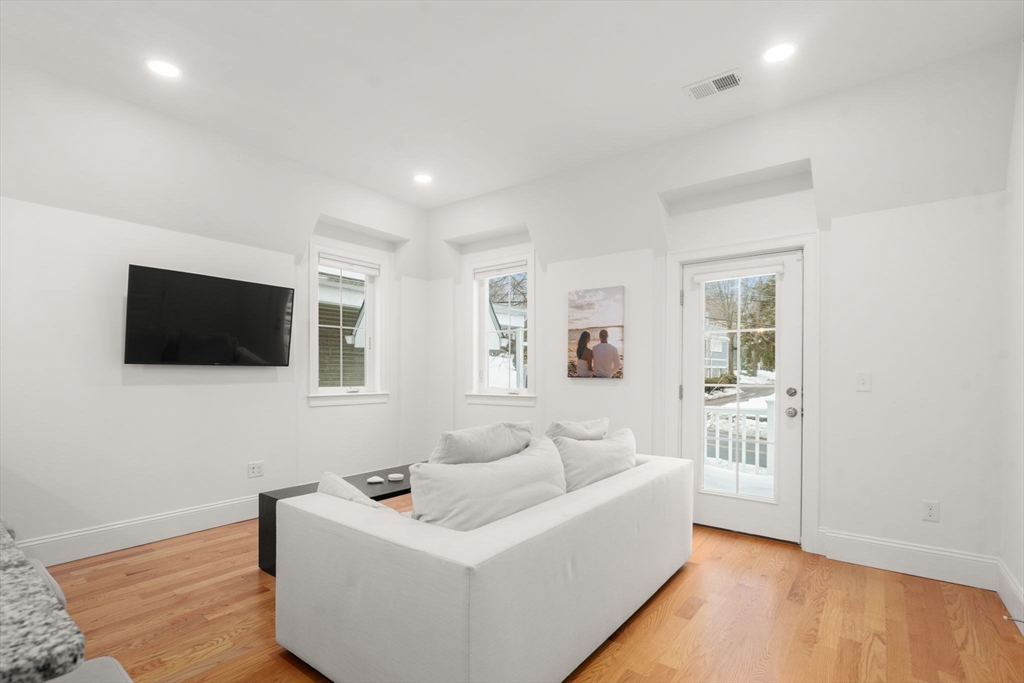 68 Chestnut Street, Unit 6 Newton, MA 02465 - Photo 6 of 22 a living room with furniture and a flat screen tv