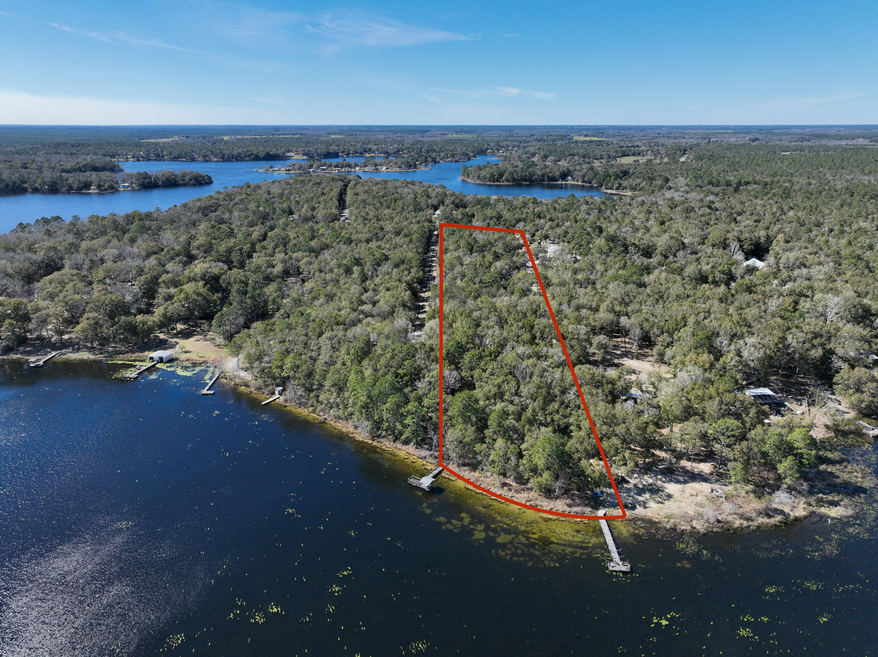 299 Holley King Road DeFuniak Springs, FL 32433 - Photo 39 of 40 a view of a lake with a mountain