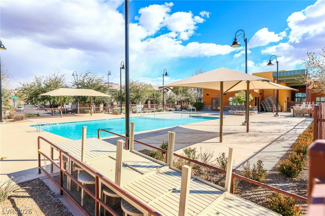 3175 Via Seranova Henderson, NV 89044 - Photo 43 of 45 This inviting community pool area offers refreshing dips and shaded relaxation under sunny skies.