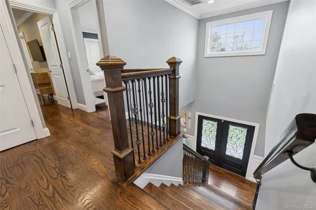 a bedroom with furniture and a flat screen tv