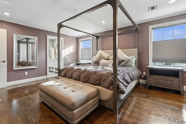 a bedroom with furniture and a window