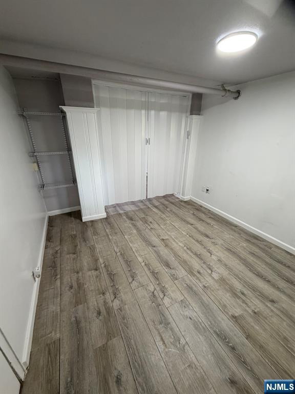 1283 Valley Road, Unit 7 Montclair, NJ 07043 - Photo 9 of 26 a view of room with wooden floor