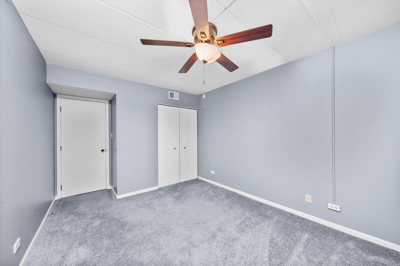 4530 West 93rd Street, Unit 1A Oak Lawn, IL 60453 - Photo 11 of 18 a view of an empty room with chandelier fan