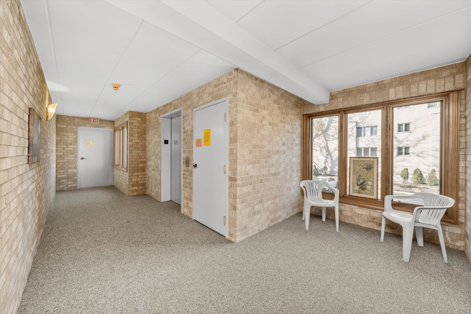 4530 West 93rd Street, Unit 1A Oak Lawn, IL 60453 - Photo 2 of 18 a view of a livingroom with furniture and floor to ceiling window