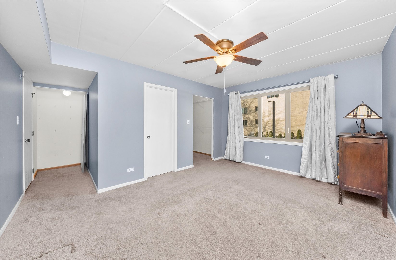 4530 West 93rd Street, Unit 1A Oak Lawn, IL 60453 - Photo 9 of 18 a view of an empty room with a window