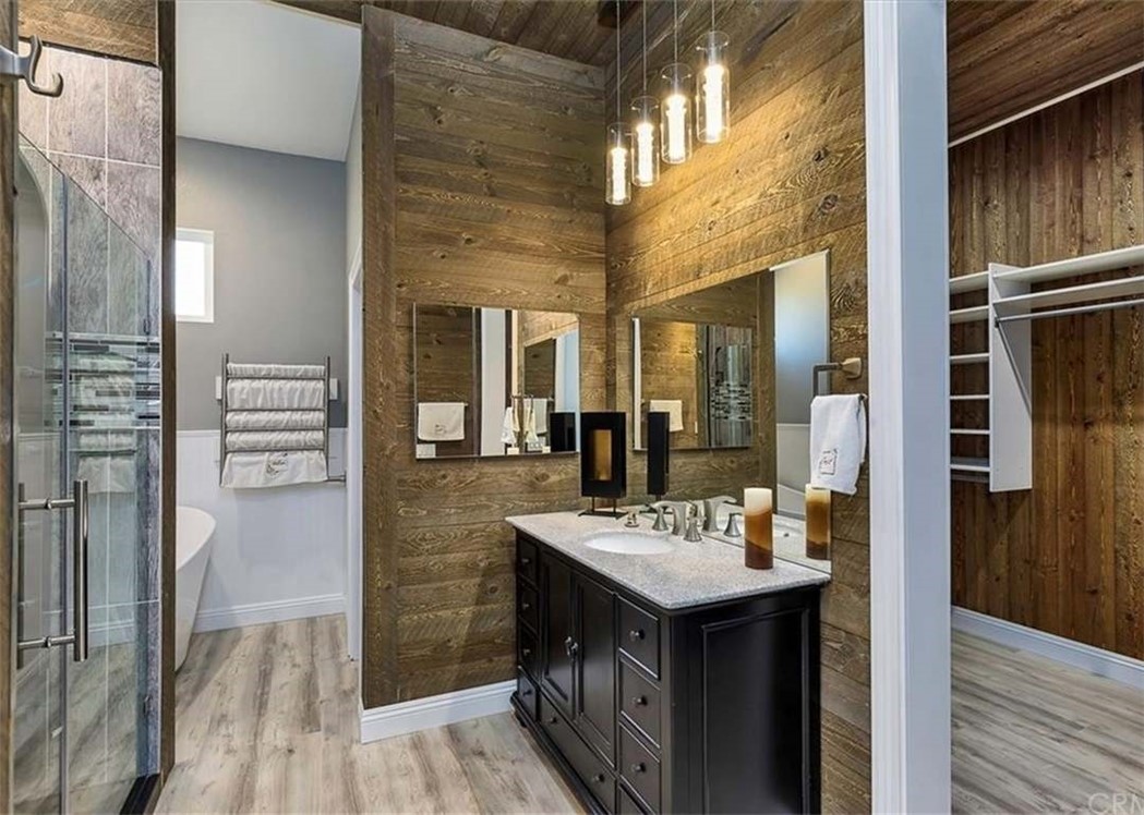 32700 Cox Road Menifee, CA 92584 - Photo 24 of 65 a bathroom with a sink a mirror and a shower