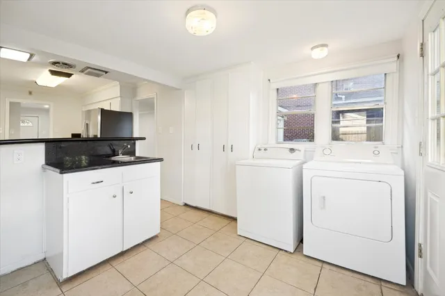 a utility room with dryer and washer
