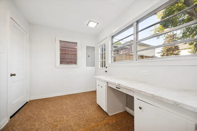 a view of a kitchen with a sink cabinets and a window