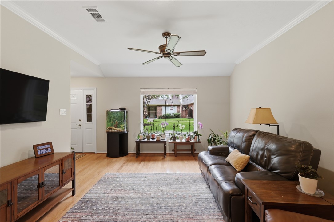 1520 Bennett Street Bryan, TX 77802 - Photo 6 of 24 a living room with furniture and a flat screen tv