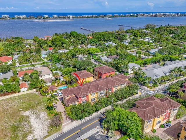 an aerial view of a city with lots of residential buildings ocean and ocean view