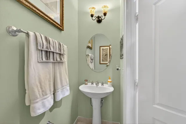 a bathroom with a sink a mirror and a shower