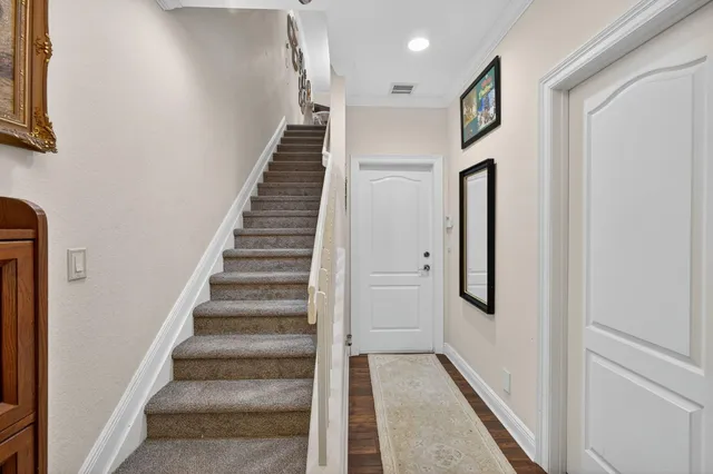 a view of entryway with stairs and wooden floor