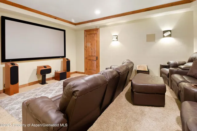a view of a patio with a table chairs and a garden