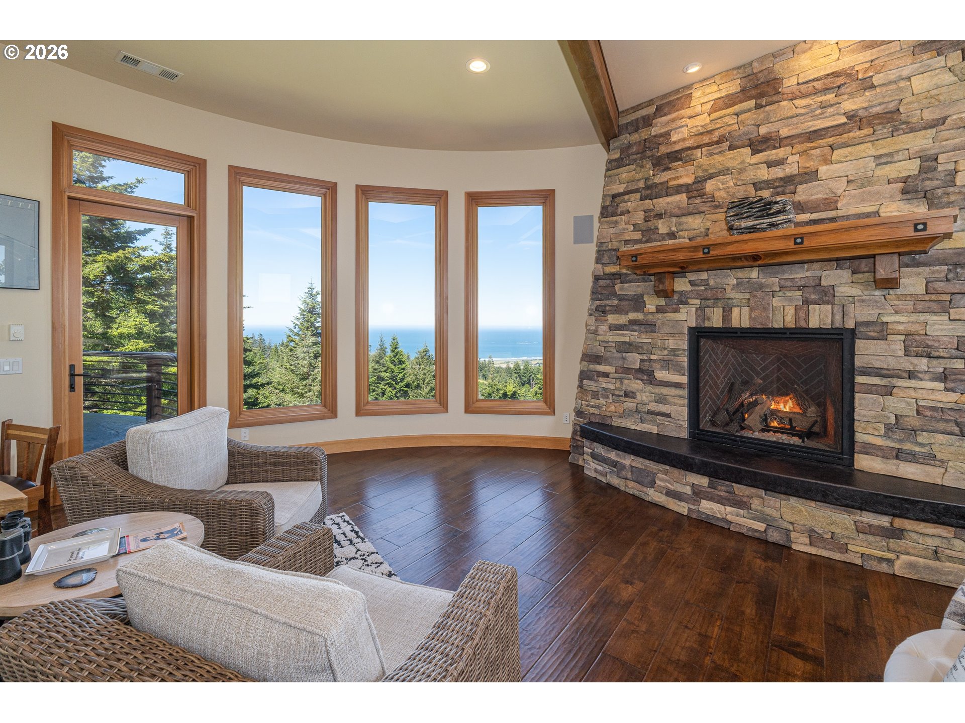 94880 Grizzly Mountain Road Gold Beach, OR 97444 - Photo 25 of 48 a living room with furniture and a fireplace