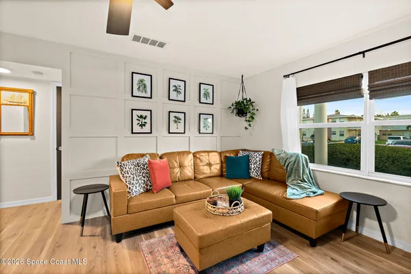a bedroom with a bed and a chair