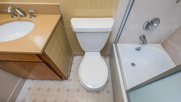 a bathroom with a sink and toilet