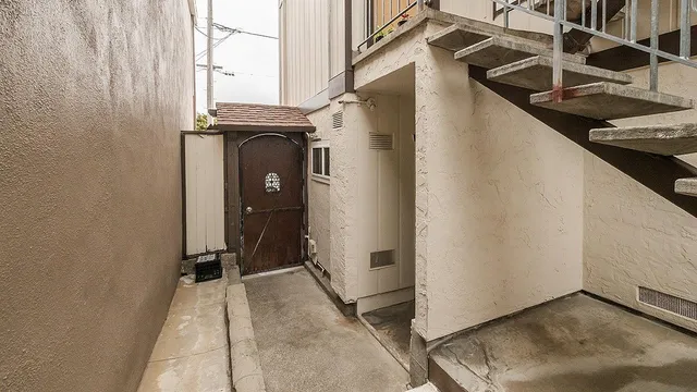 a view of a house with entryway and wooden floor