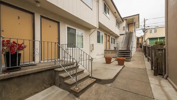 a view of a balcony with chairs
