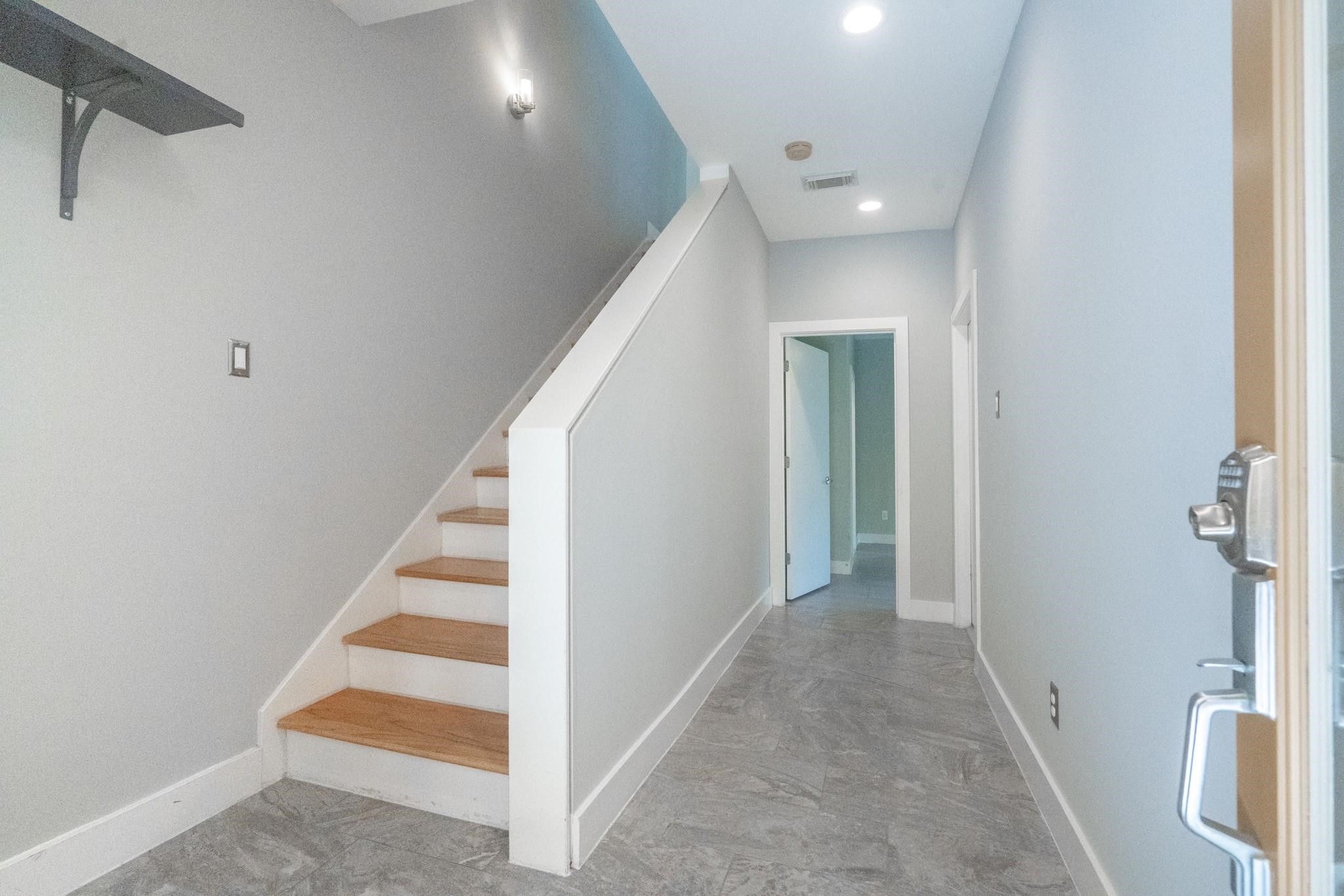4302 Spencer Street Houston, TX 77007 - Photo 14 of 21 a view of a hallway with staircase