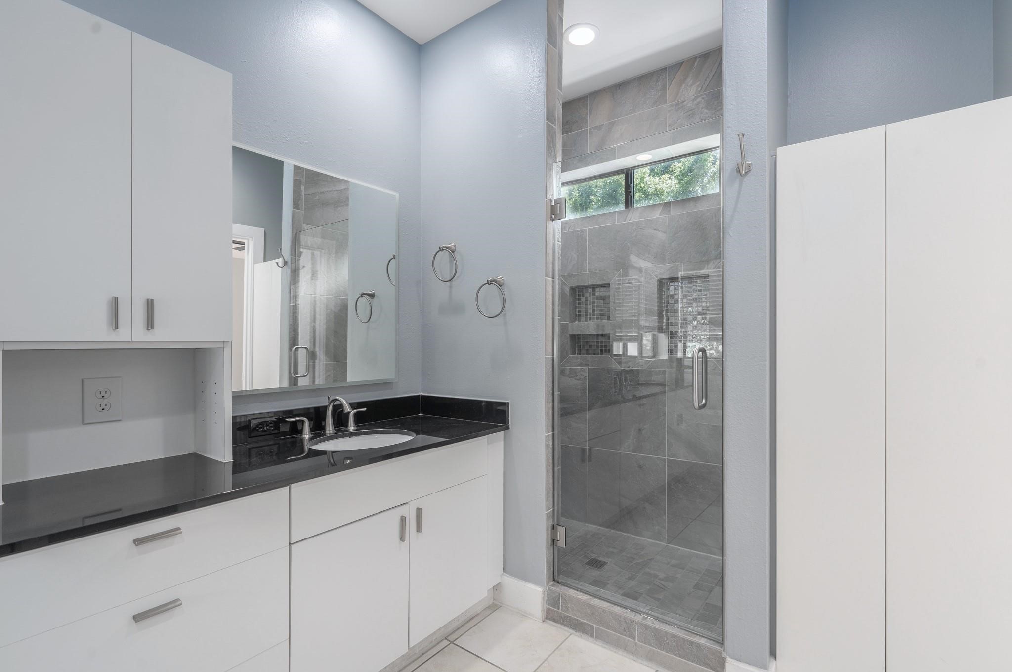 4302 Spencer Street Houston, TX 77007 - Photo 9 of 21 a bathroom with a shower