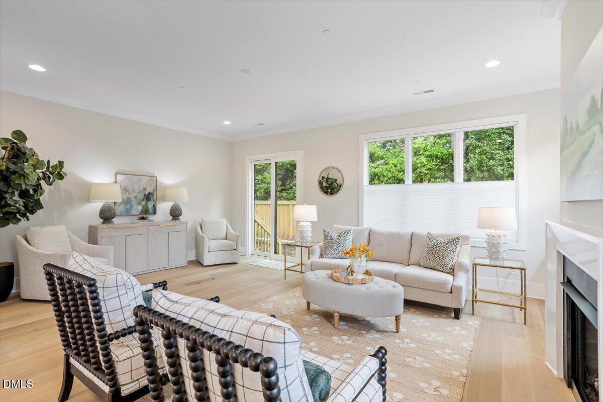 811 Maple Berry Lane, Unit 101 Raleigh, NC 27607 - Photo 15 of 45 a living room with furniture and a large window