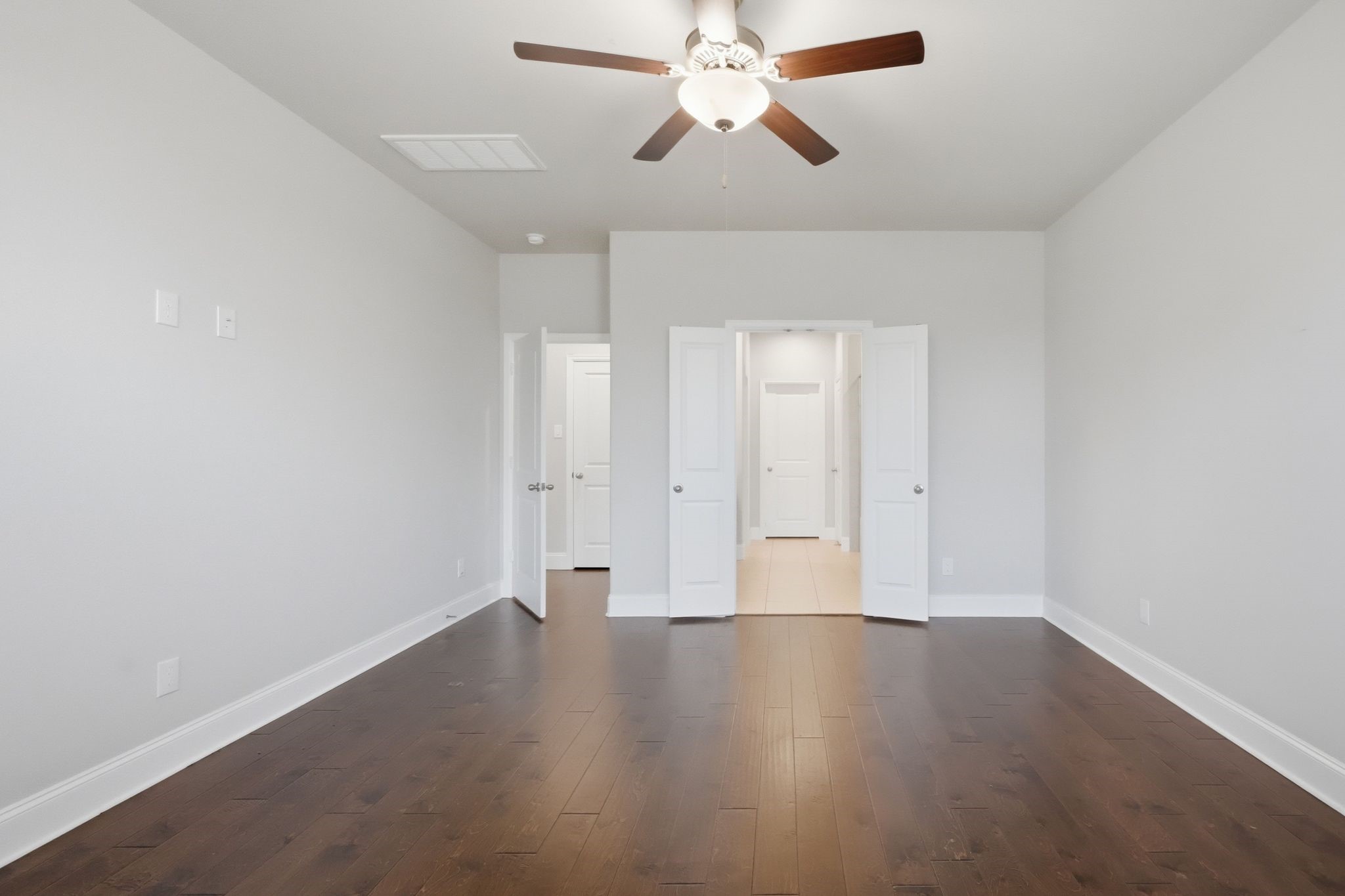 2809 Andante Green Drive Spring, TX 77386 - Photo 17 of 50 an empty room with wooden floor and windows