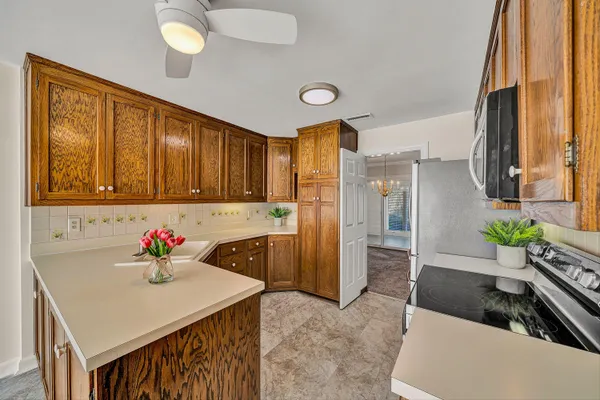 a living room with granite countertop furniture and a kitchen