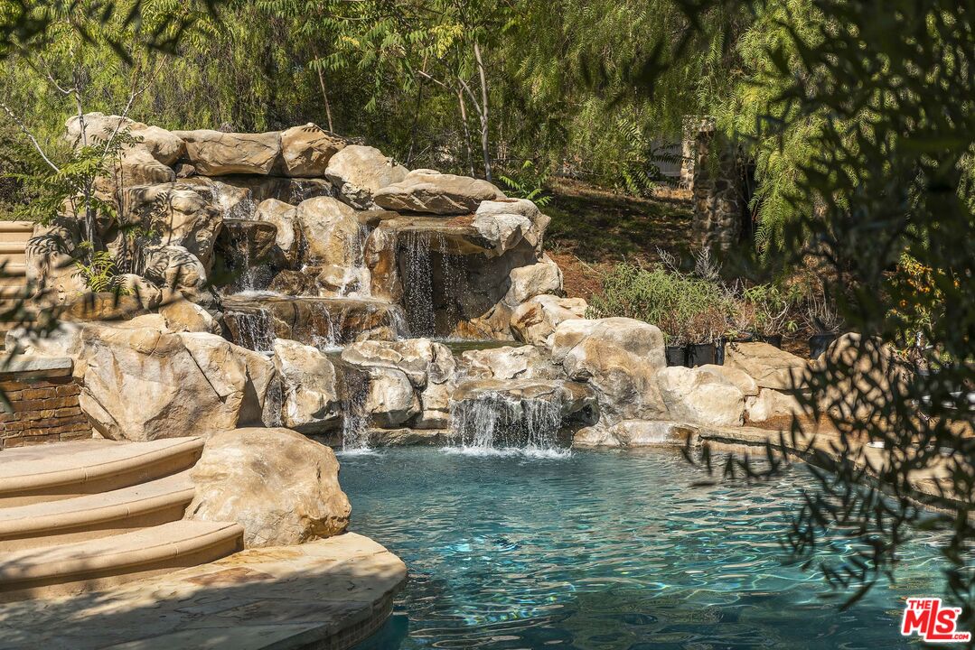 2251 Cold Canyon Road Calabasas, CA 91302 - Photo 31 of 47 a view of swimming pool with a yard