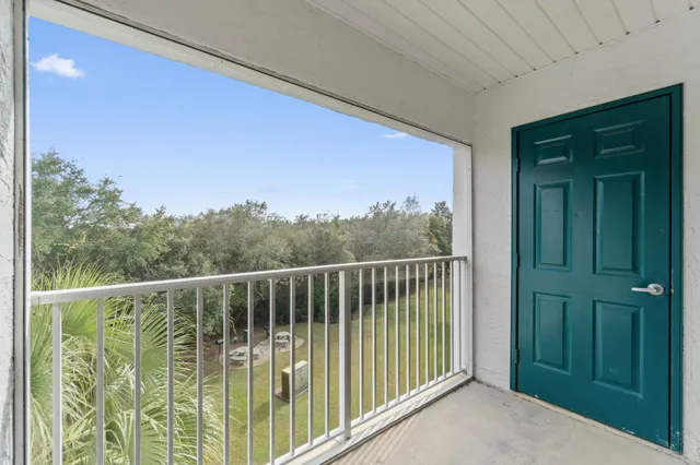 a front view of a house with sitting area