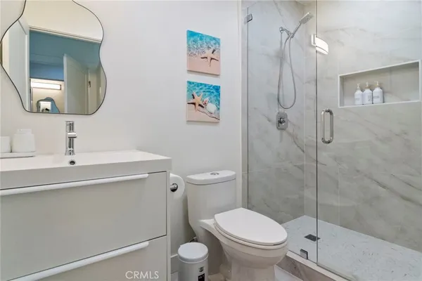 a bathroom with a toilet sink and shower
