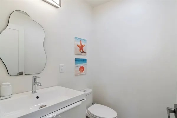 a bathroom with a toilet and a sink