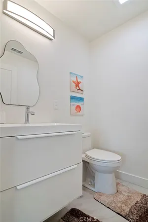 a kitchen with stainless steel appliances granite countertop a sink and a refrigerator