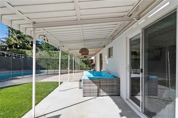 a view of a tennis court with a fence